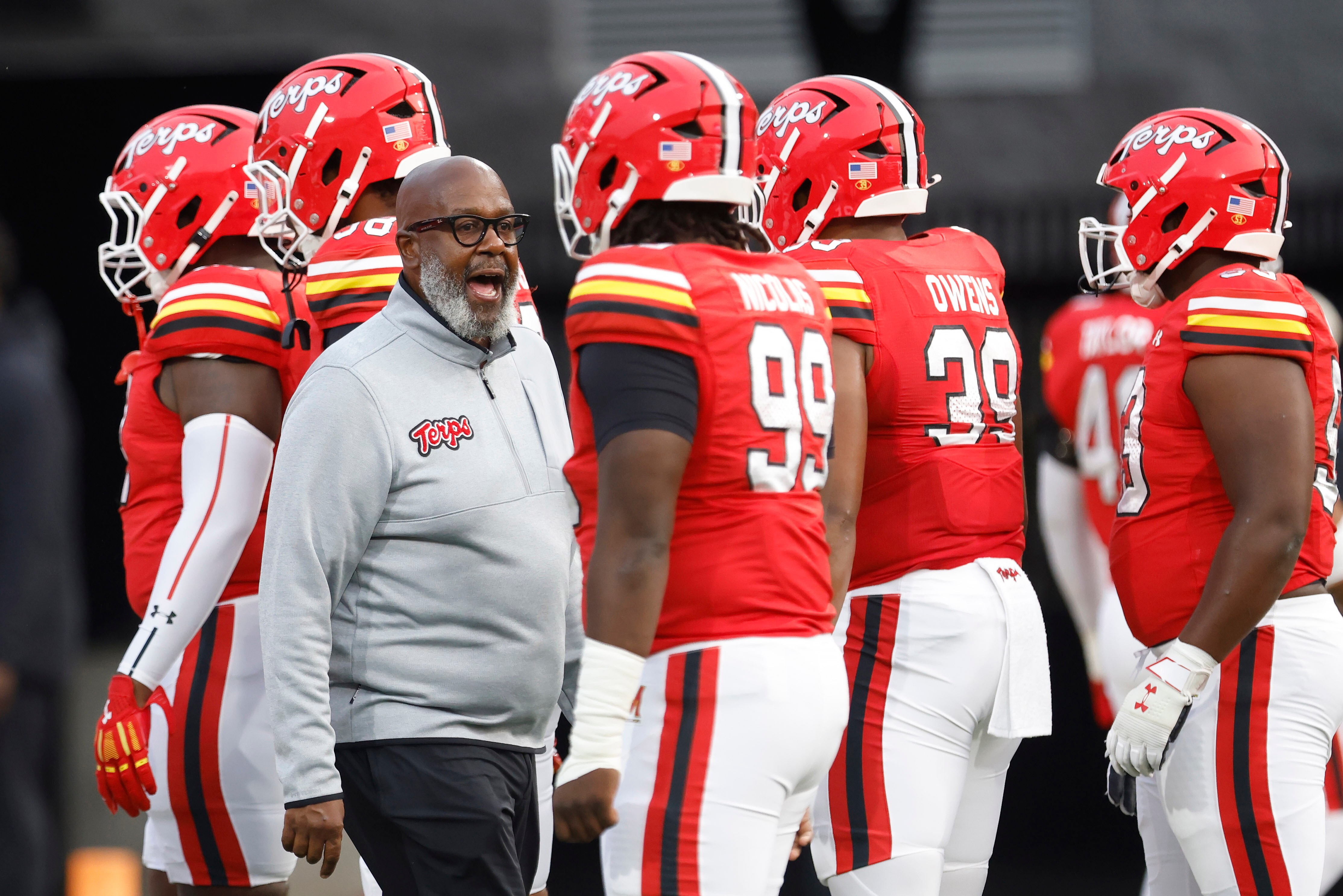 FILE - Maryland head coach Mike Locksley encourages his players before an NCAA football game against Northern Illinois, Sept. 5, 2025, in College Park, Md. 