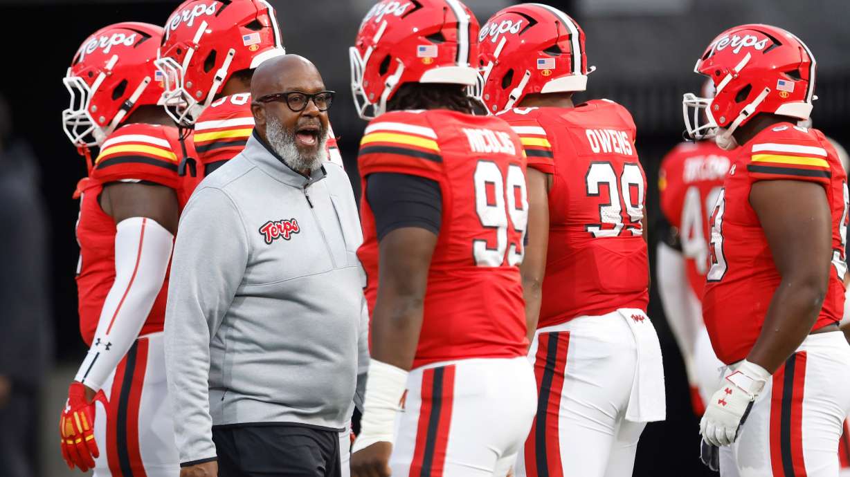FILE - Maryland head coach Mike Locksley encourages his players before an NCAA football game against Northern Illinois, Sept. 5, 2025, in College Park, Md.