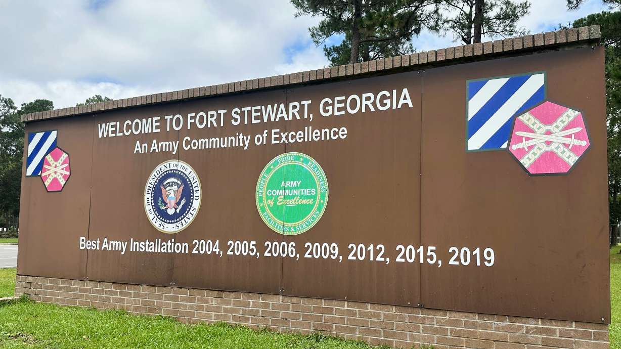 A sign stands outside the main gate of Fort Stewart, Ga., Aug. 6, 2025. The Army unit at the base is offering its troops a special bonus if they reenlist: four extra days off timed around the November release of the video game Grand Theft Auto VI.