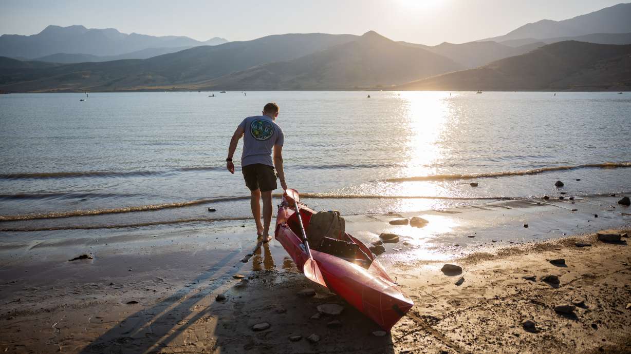 Chase Kimball gets ready to fish in Deer Creek Reservoir in Wasatch County on July 30. Utah's reservoir system is now down to 52% capacity following a record-low snowpack last winter.