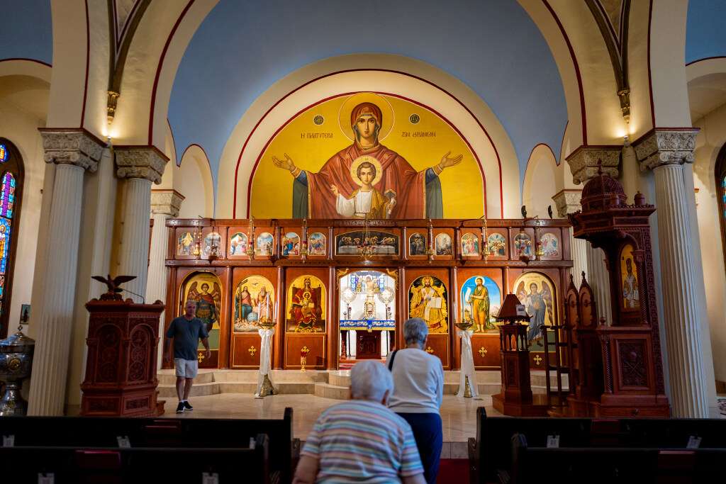 George Karahalios, parish counselor president, left; Vicki Peters, adviser to the Hellenic Cultural Association, center; and Georgette Kapos, Hellenic Cultural Association board member, right, give KSL a tour of the Greek Orthodox Church of Greater Salt Lake in Salt Lake City on Aug. 18.