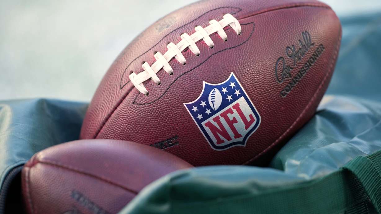 FILE - Footballs are seen before an NFL football game in Philadelphia on Jan. 4, 2026.