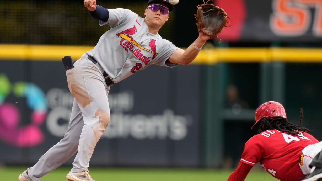 Cincinnati Reds Elly De La Cruz, right, steals second base as St. Louis Cardinals second baseman JJ Wetherholt, left, takes the throw during the eighth inning of a baseball game, Thursday, Aug. 20, 2026, in Cincinnati.