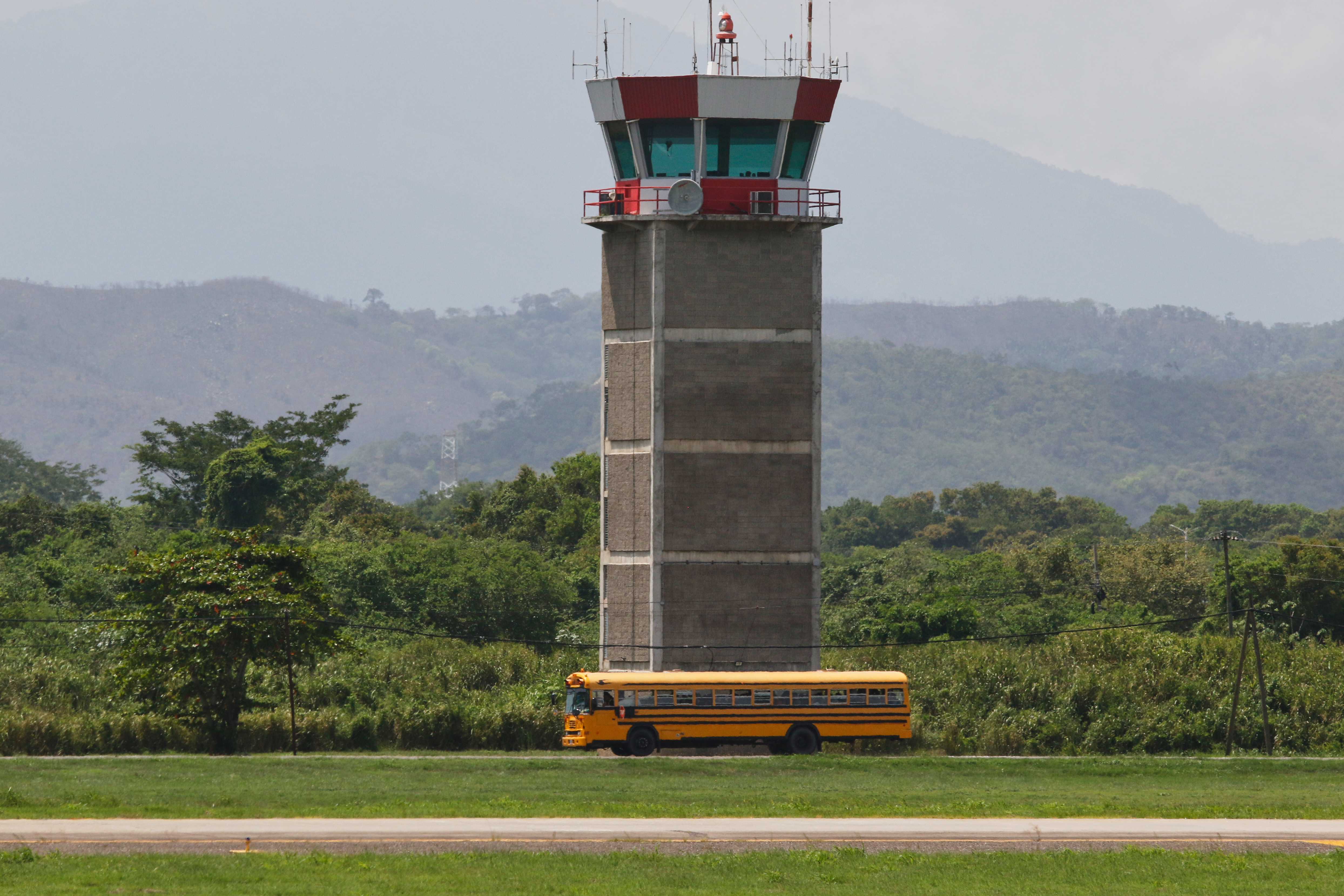 Migrants deported from the United States are transported in a bus after arriving on plane at the Ramon Villeda Morales Airport in San Pedro Sula, Honduras, on Thursday.