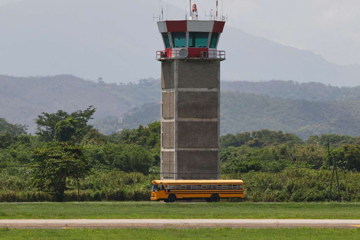 Migrants deported from the United States are transported in a bus after arriving on plane at the Ramon Villeda Morales Airport in San Pedro Sula, Honduras, on Thursday.