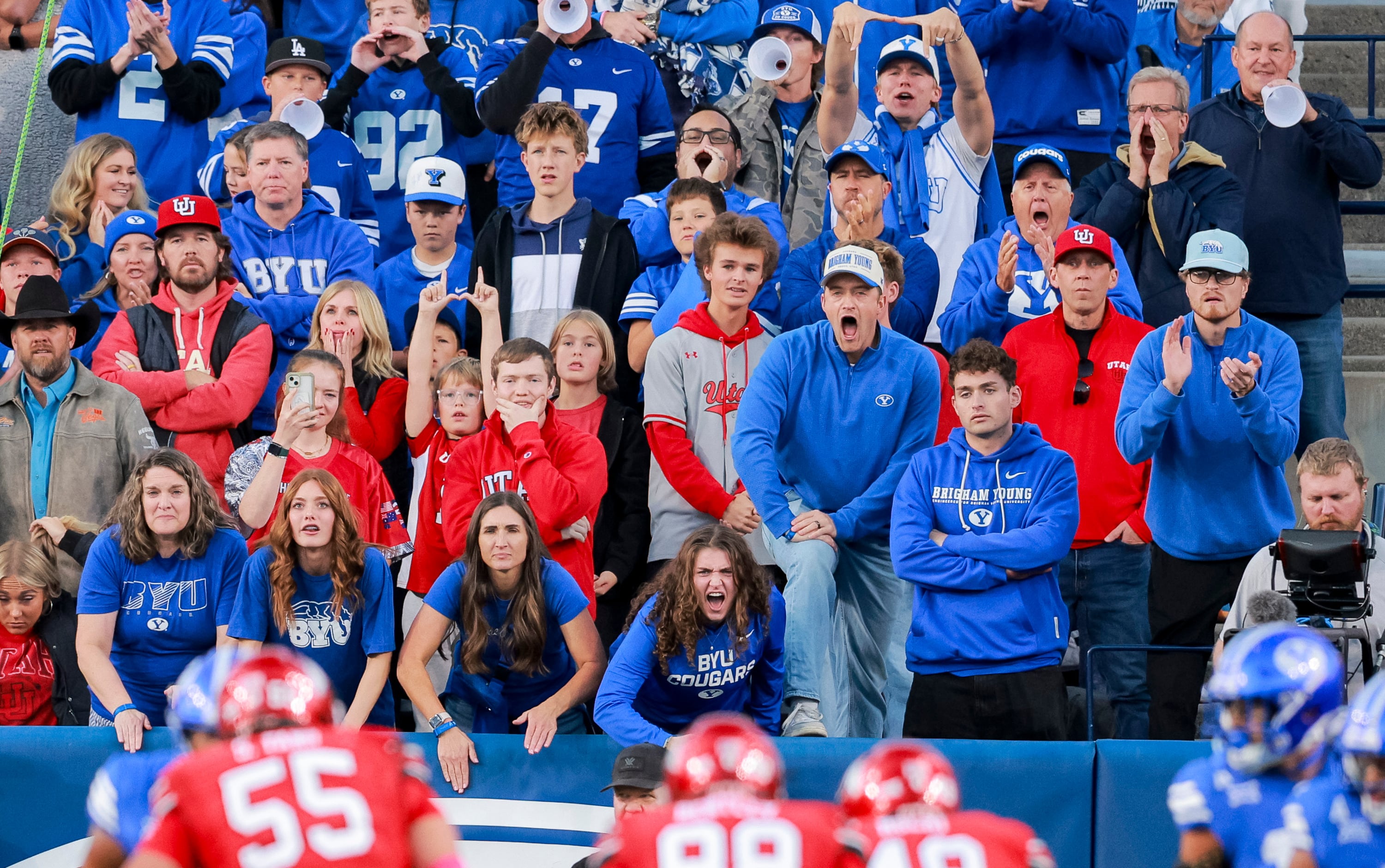 Fans yell during the first quarter of the game between BYU and Utah at LaVell Edwards Stadium in Provo on Saturday, Oct. 18, 2025.