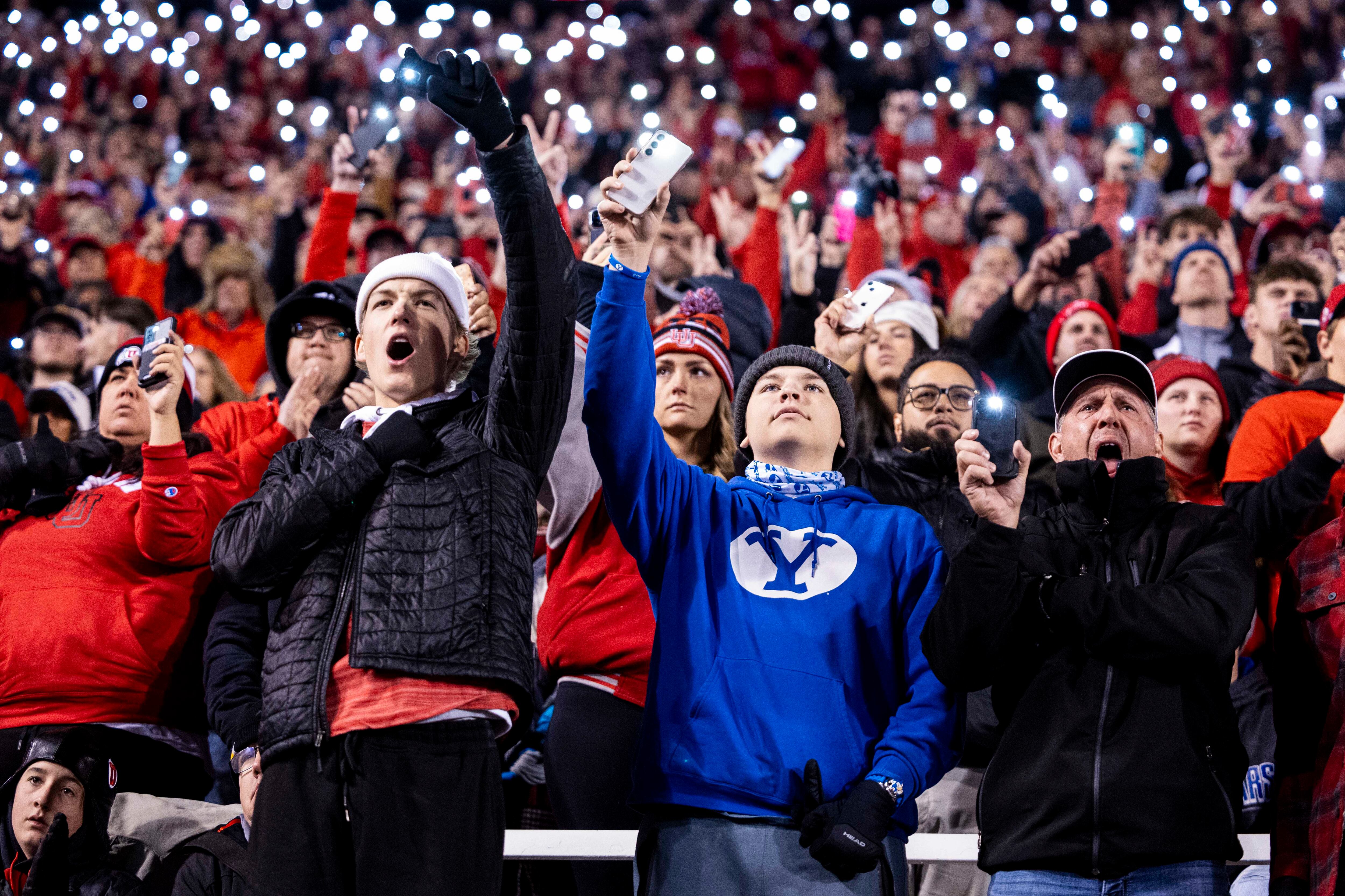 Fans from both the Utah Utes and BYU commemorate the lives of Ty Jordan and Aaron Lowe during a game between the University of Utah Utes and the Brigham Young University Cougars held at Rice-Eccles Stadium in Salt Lake City on Saturday, Nov. 10, 2024.