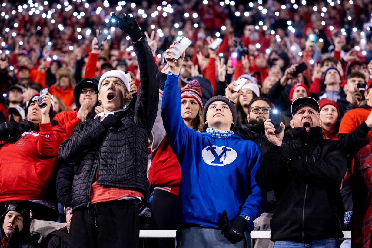 Fans from both the Utah Utes and BYU commemorate the lives of Ty Jordan and Aaron Lowe during a game between the University of Utah Utes and the Brigham Young University Cougars held at Rice-Eccles Stadium in Salt Lake City on Saturday, Nov. 10, 2024.