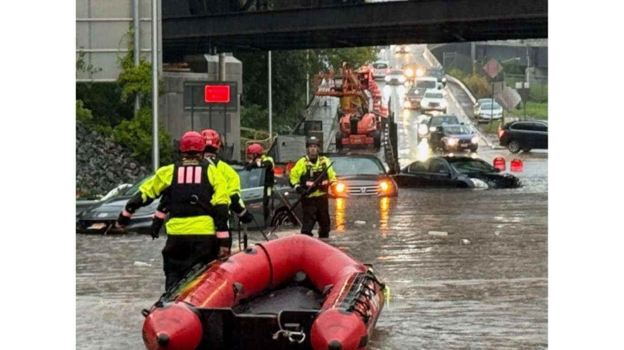 In this photo provided by the City of Jersey City, first responders try to rescue people stranded in Jersey City, N.J., Thursday, Aug. 20, 2026, after storms went through the area.