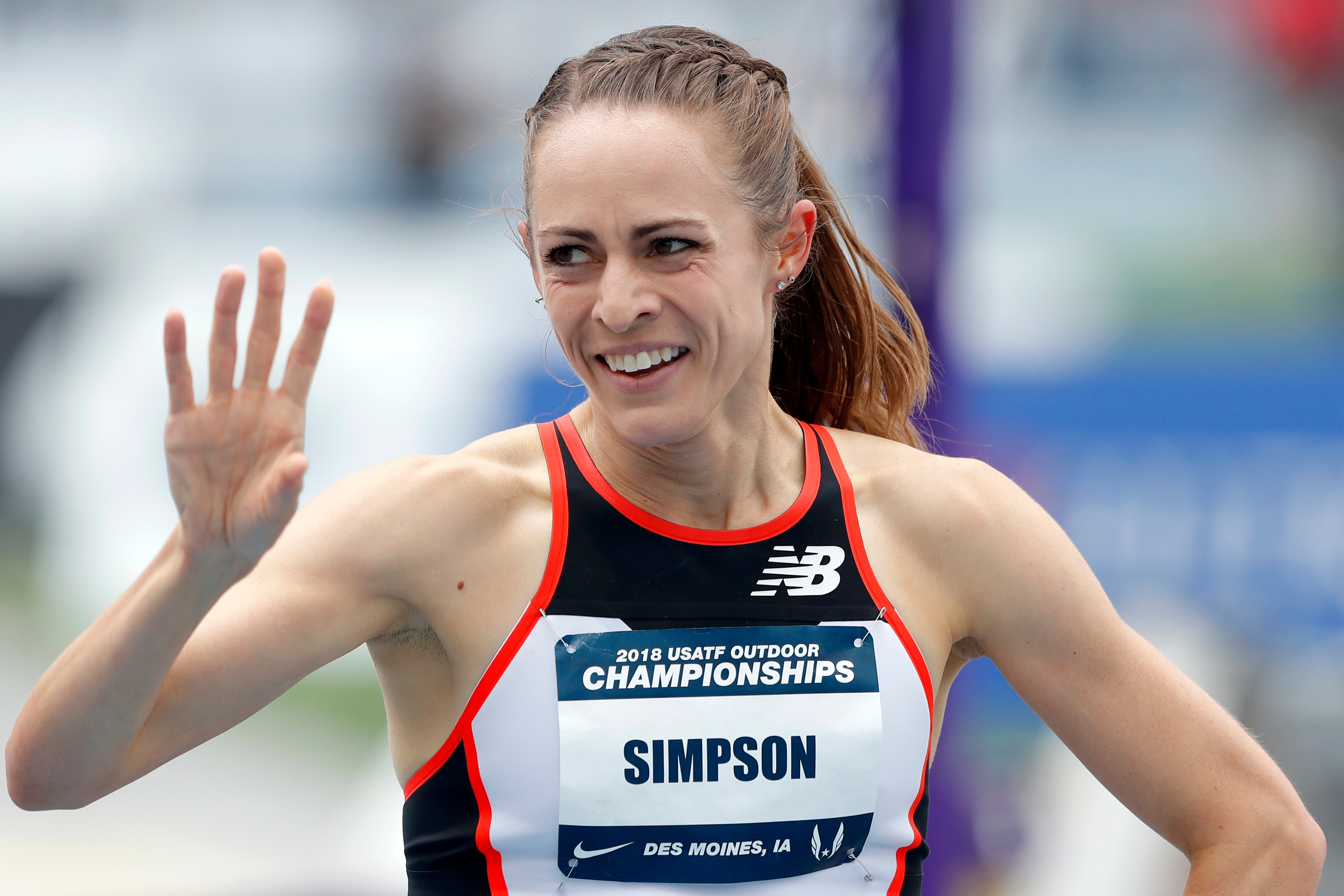 FILE - Jenny Simpson waves to a fan after winning her heat in the women's 1,500-meter run at the U.S. Championships athletics meet, Thursday, June 21, 2018, in Des Moines, Iowa. 
