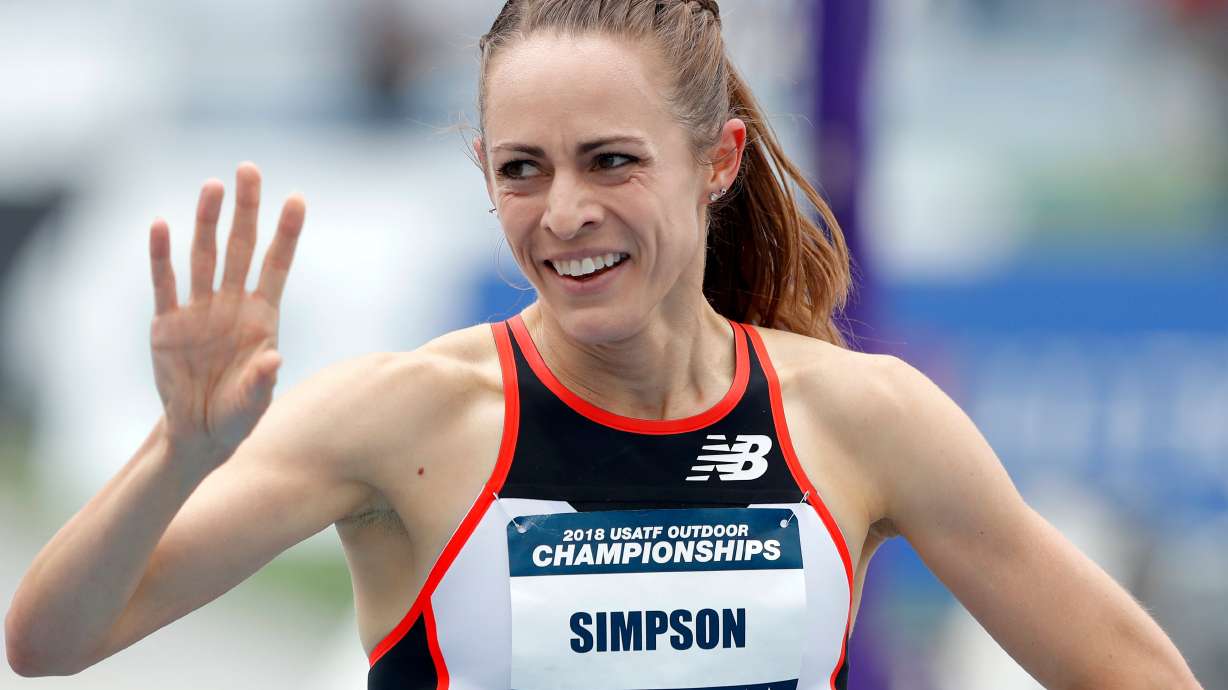FILE - Jenny Simpson waves to a fan after winning her heat in the women's 1,500-meter run at the U.S. Championships athletics meet, Thursday, June 21, 2018, in Des Moines, Iowa.