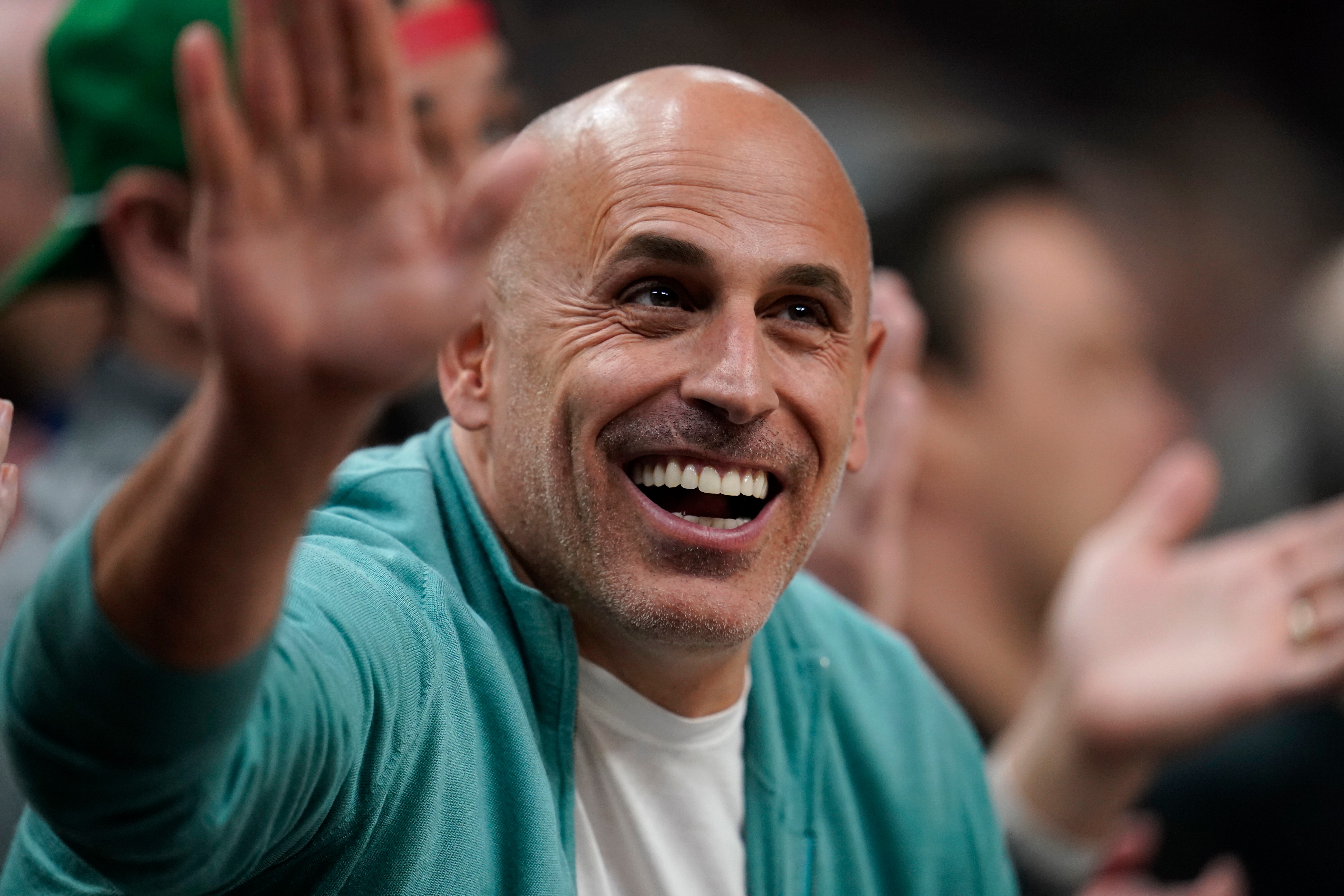 FILE - Minnesota Timberwolves co-owner Marc Lore cheers during the first half of an NBA basketball game against the New Orleans Pelicans, April 9, 2023, in Minneapolis. 