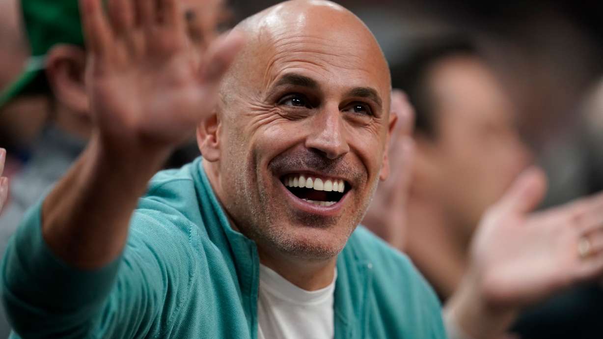 FILE - Minnesota Timberwolves co-owner Marc Lore cheers during the first half of an NBA basketball game against the New Orleans Pelicans, April 9, 2023, in Minneapolis.