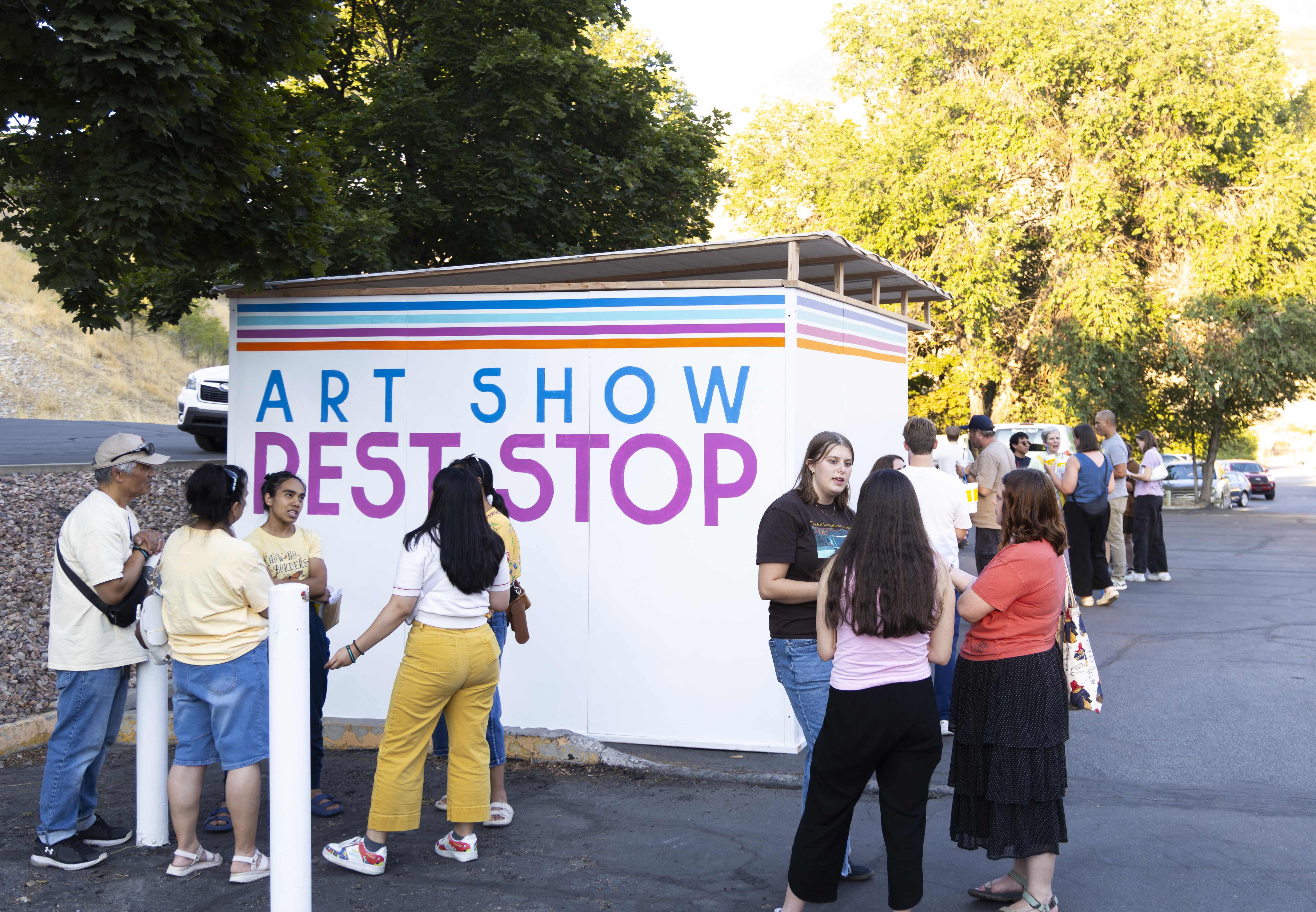 People gather to look at the "Rest Stop" art show at Will's Canyon Stop in Orem. The art show, created by BYU students, was on display from Aug. 3 to 8.