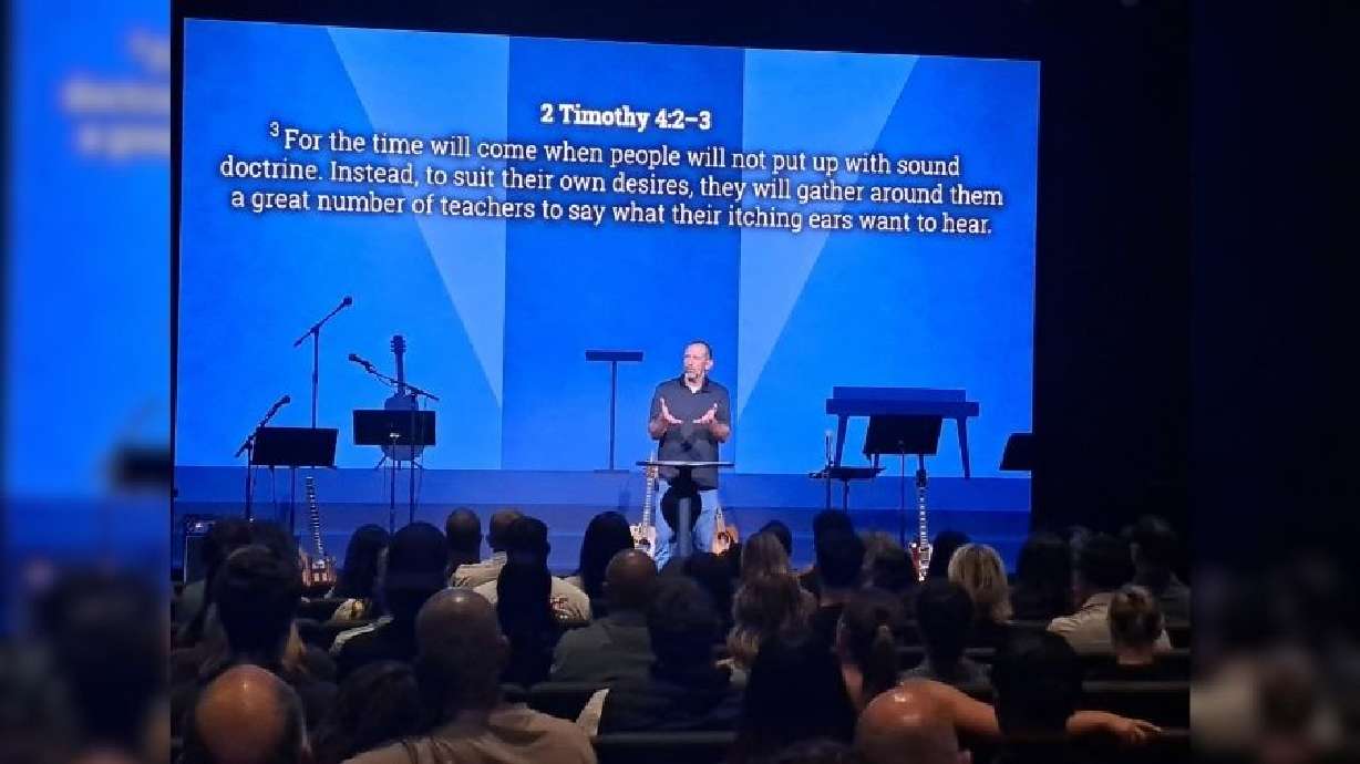 Pastor John Belles preaches to members of the Alpine Church at the new Logan campus, Aug. 16.