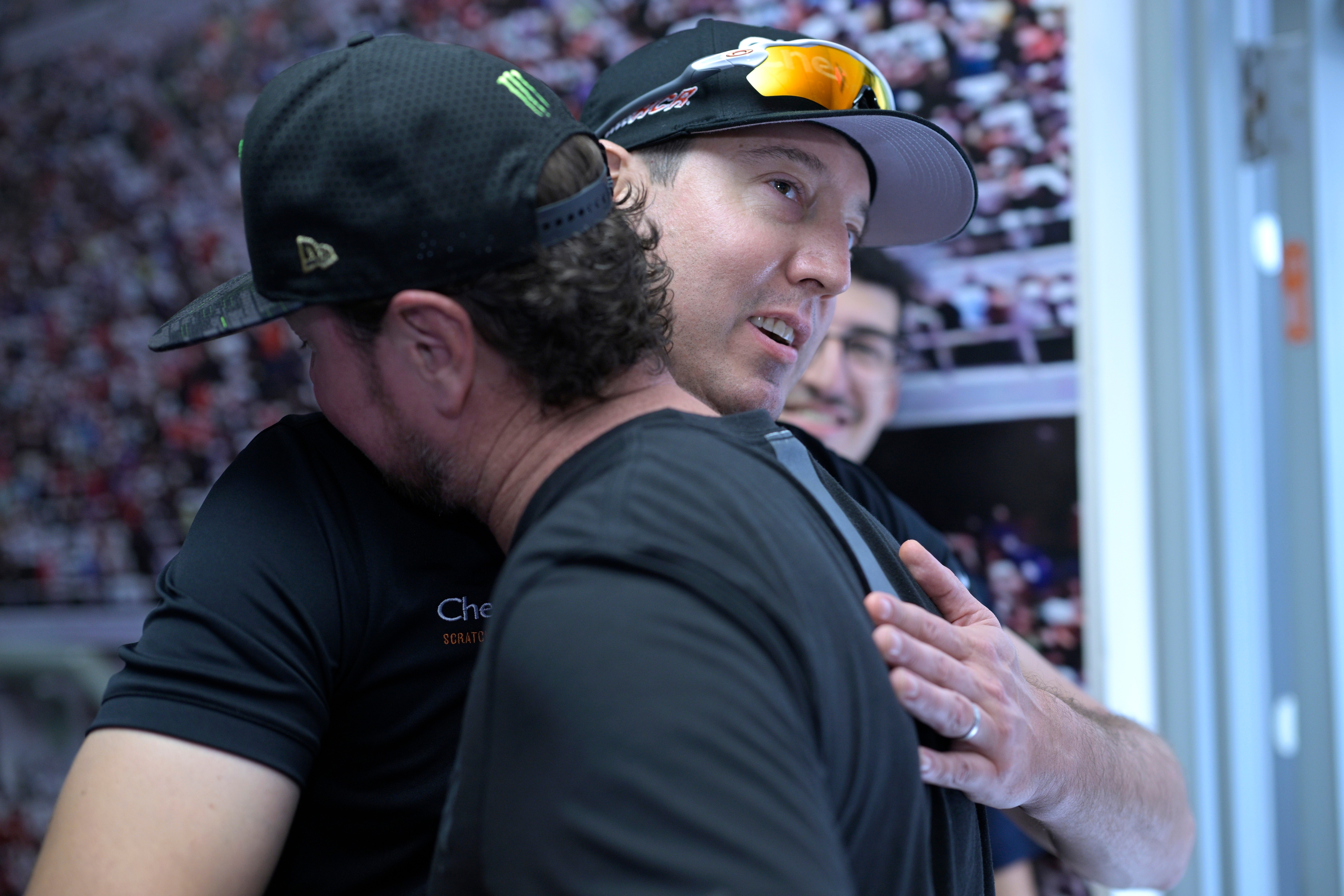 FILE - Kurt Busch, front, gets a hug from his brother, Kyle Busch, after announcing his retirement before a NASCAR Cup Series auto race at Daytona International Speedway, Aug. 26, 2023, in Daytona Beach, Fla. 