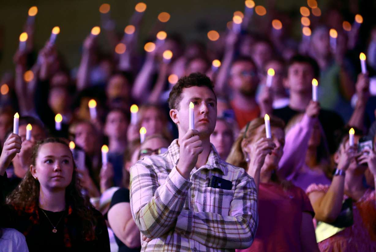 Attendees hold up battery operated candles during a Vigil for Unity at the UCCU Center at Utah Valley University in Orem on Friday, Sept. 19, 2025. Charlie Kirk, conservative activist and the founder and president of Turning Point USA, was fatally shot while answering questions at his American Comeback Tour at UVU on Sept. 10.