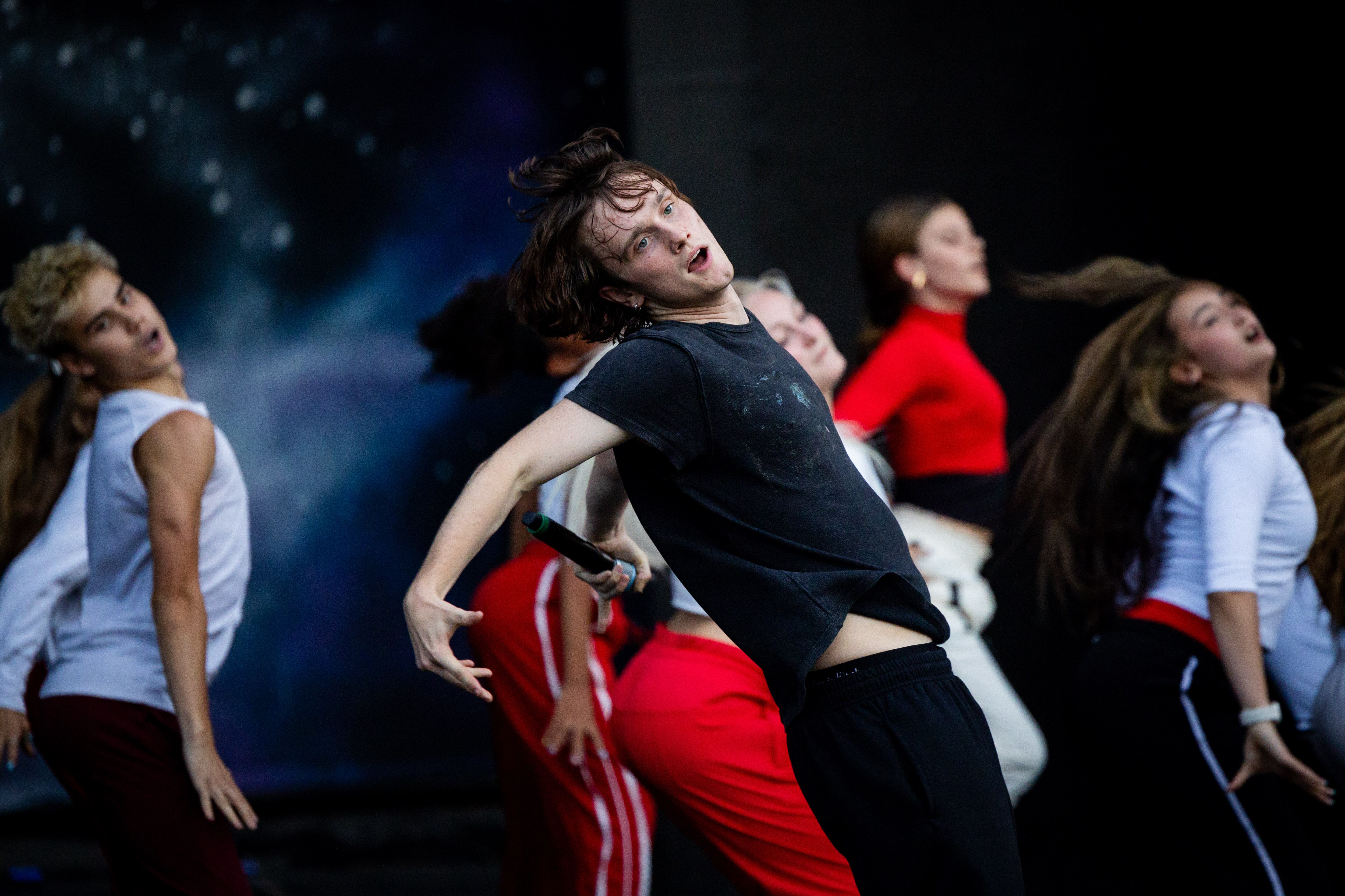 Oliver Hincy, from Utah, a member of the Full Circle Boys, and dancers from Center Stage Performing Arts studio, Hi-Light Dance and Charisma Dance Studio rehearse for the 21st annual "Dancing Under the Stars" at the SCERA Shell Outdoor Theatre  in Orem on Thursday.