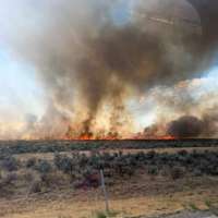 Grass fire in Garland prompts I-15 closure, neighborhood evacuation