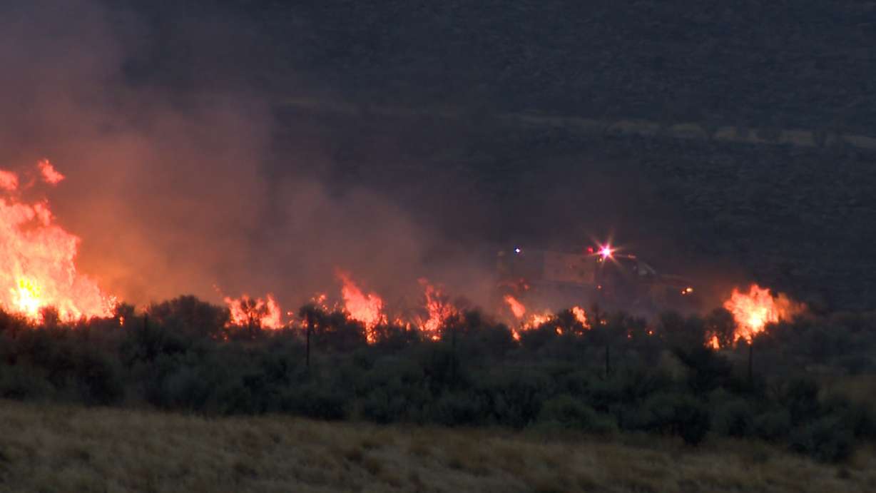 A grass fire in Garland on Friday afternoon prompted an I-15 closure and an evacuation for Harley Drive residents.