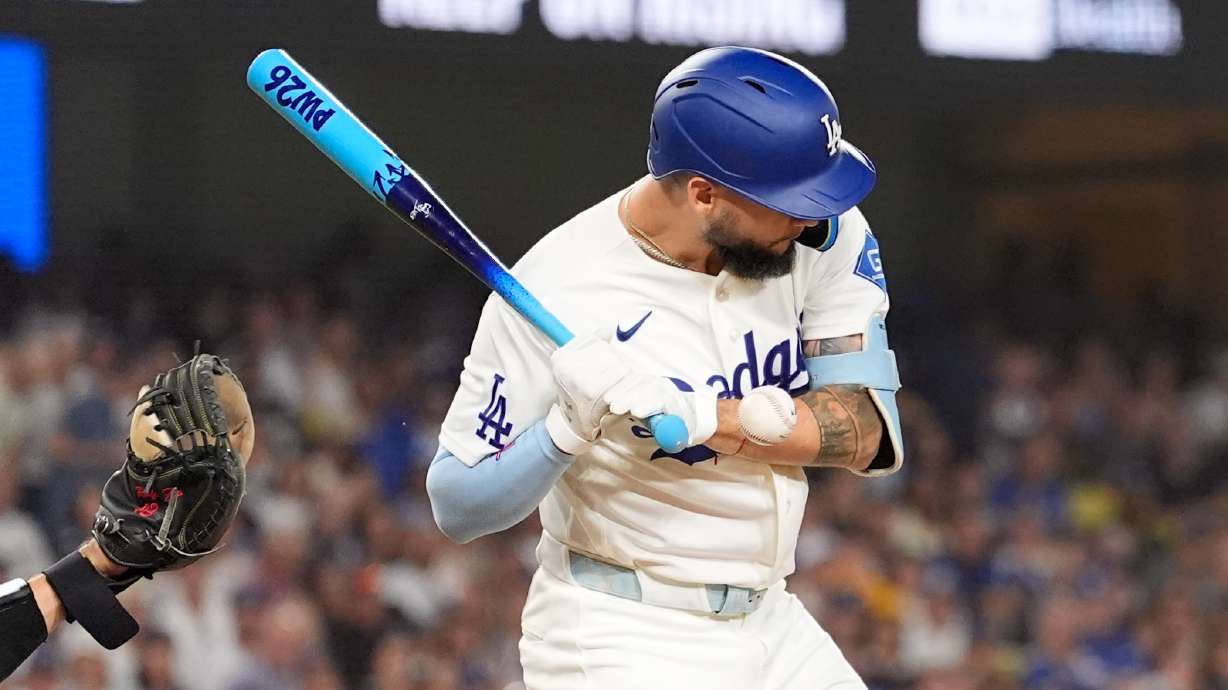 Los Angeles Dodgers' Andy Pages is hit in the hand by a pitch during the third inning of a baseball game against the Pittsburgh Pirates, Friday, Aug. 21, 2026, in Los Angeles.