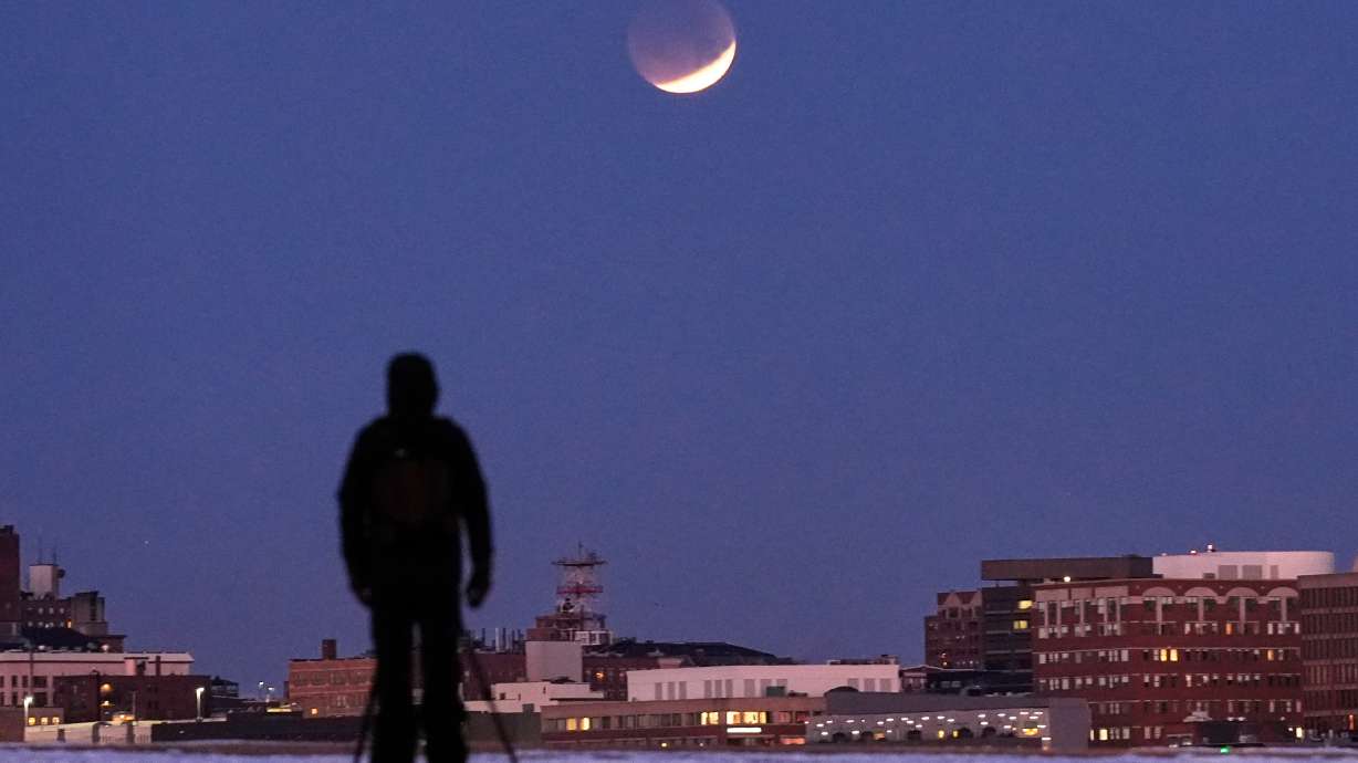 A man views the lunar eclipse, March 3, in South Portland, Maine.