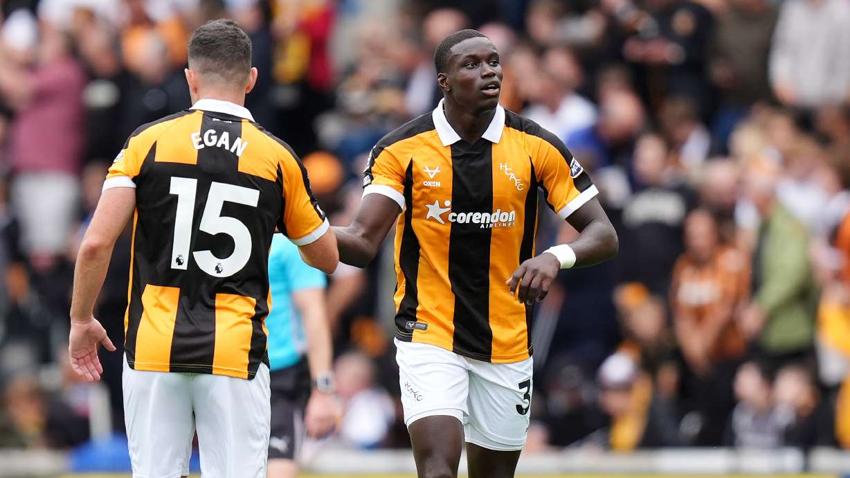 Hull City's Nobel Mendy, right, celebrates scoring during the English Premier League soccer match between Hull City and Manchester United in Kingston upon Hull, England, Saturday Aug. 22, 2026.