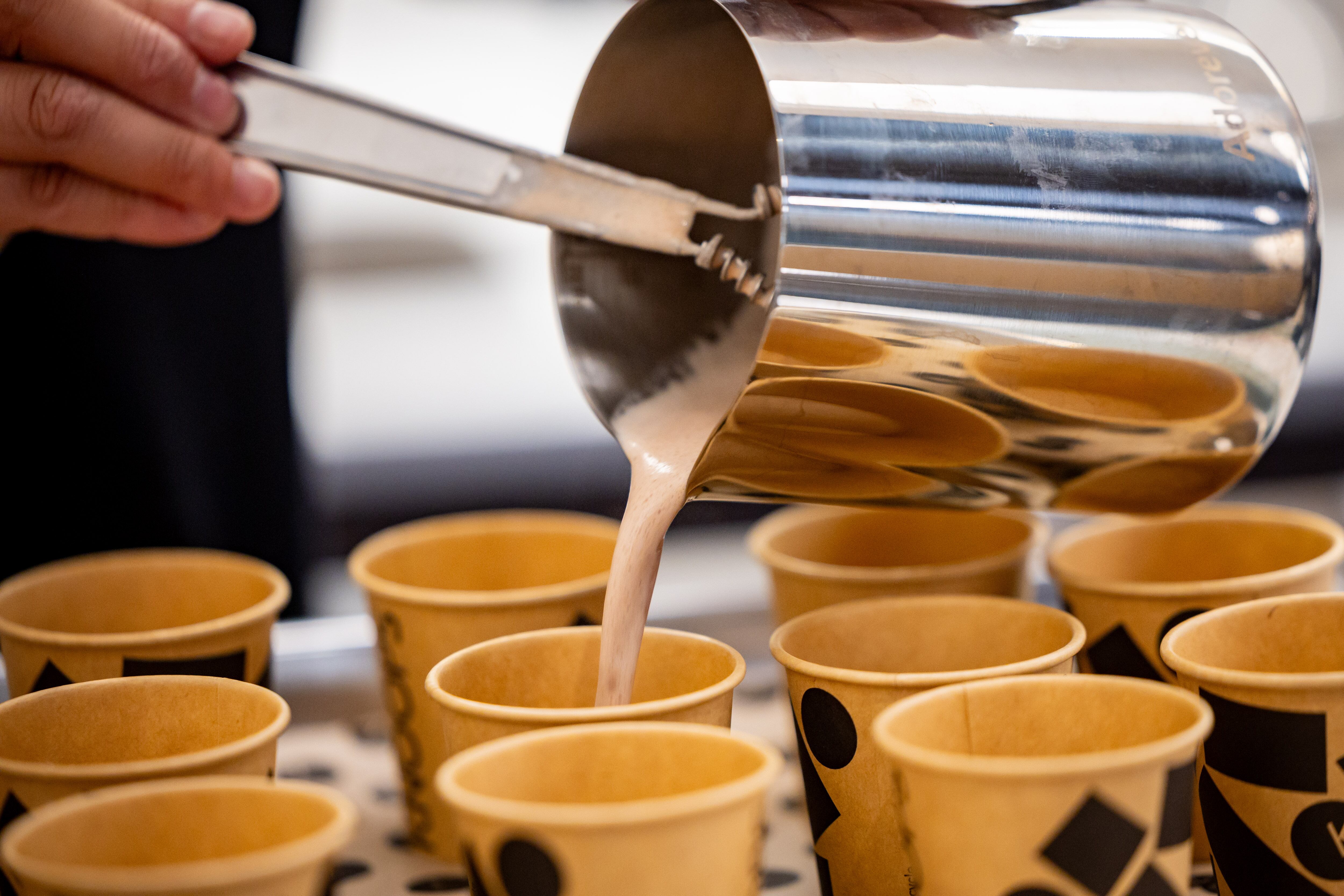 Jess, no last name given, project manager at Knoops, makes drinking chocolate for a media event at Knoops Drinking Chocolate in Salt Lake City on Tuesday. Knoops, the first of the European chain's U.S. stores, opened on Saturday.