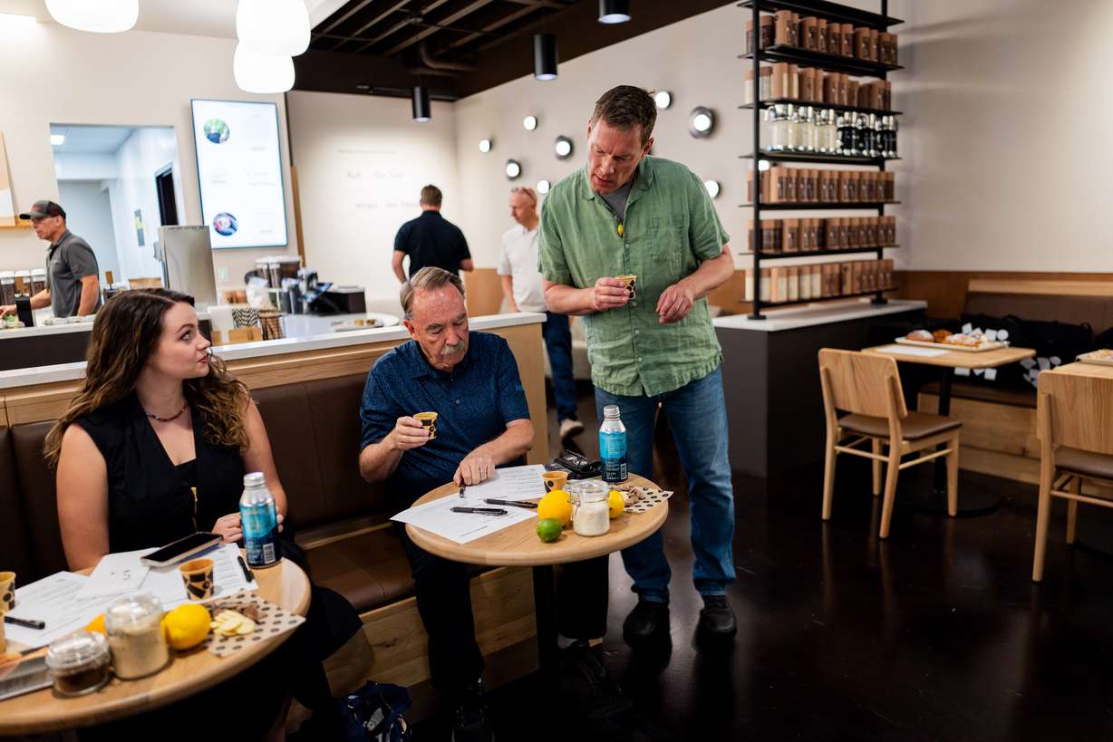 Jens Knoop, founder of Knoops, right, speaks to the press at a media event at Knoops Drinking Chocolate in Salt Lake City on Tuesday. Knoops, the first of the European chain's U.S. stores, opened on Saturday.