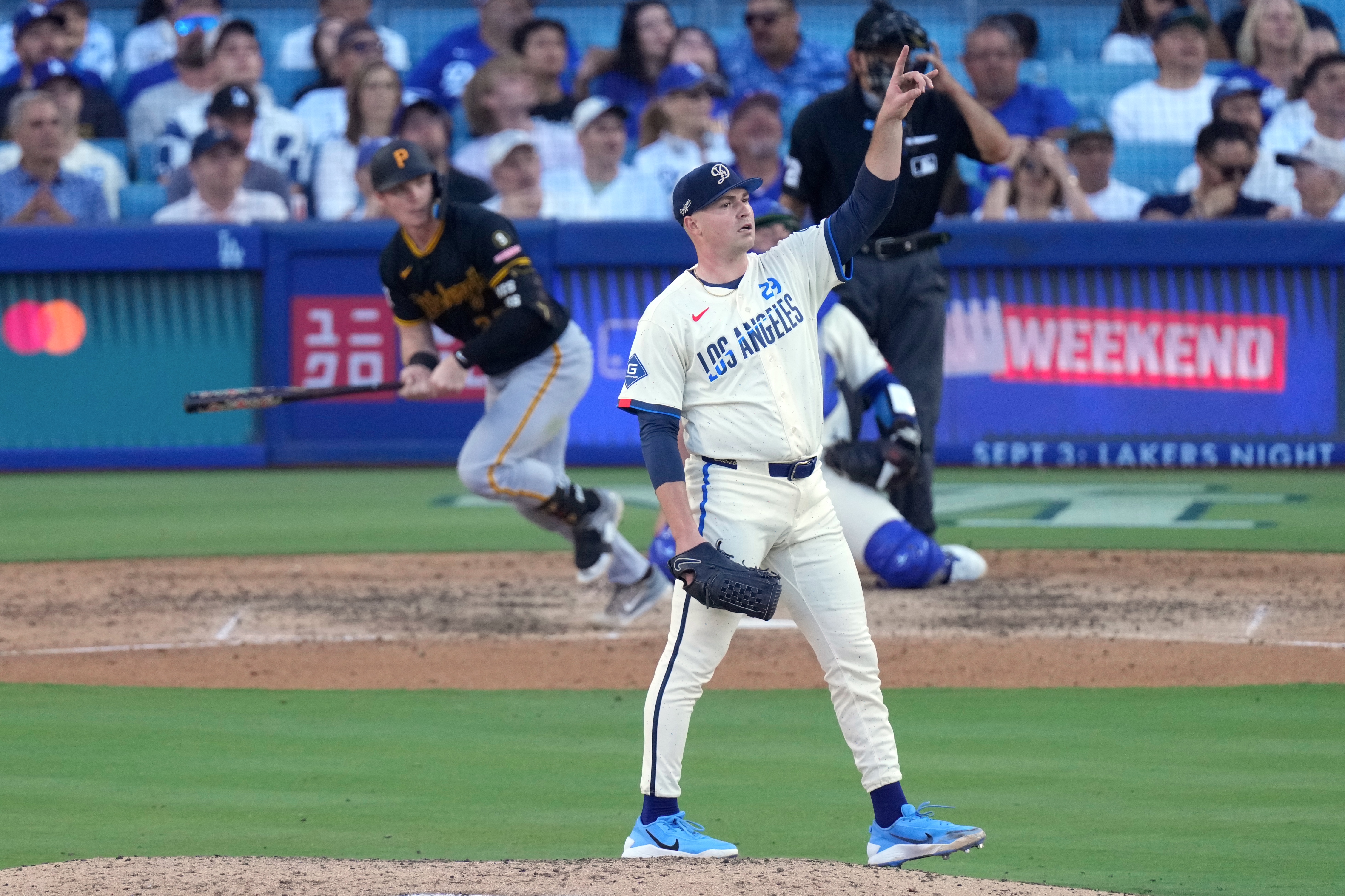 Los Angeles Dodgers starting pitcher Tarik Skubal, right, gestures as Pittsburgh Pirates' Henry Davis flies out during the seventh inning of a baseball game Saturday, Aug. 22, 2026, in Los Angeles. 
