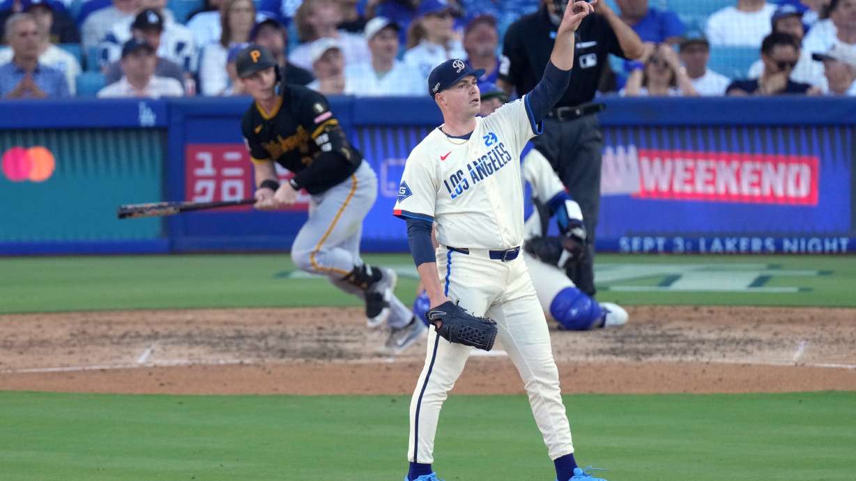 Los Angeles Dodgers starting pitcher Tarik Skubal, right, gestures as Pittsburgh Pirates' Henry Davis flies out during the seventh inning of a baseball game Saturday, Aug. 22, 2026, in Los Angeles.