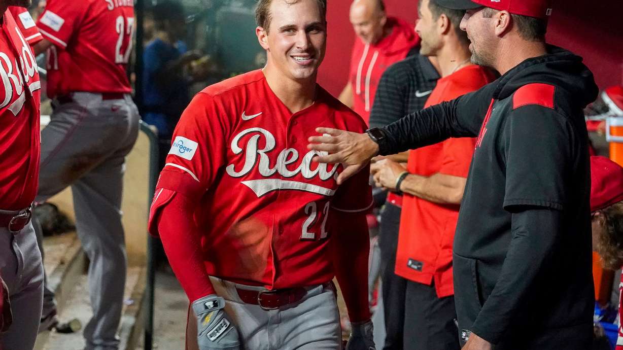 Cincinnati Reds' JJ Bleday, is all smiles after hitting a home run to complete hitting for the cycle during the sixth inning of a baseball game against the Arizona Diamondbacks, Saturday, Aug. 22, 2026, in Phoenix.