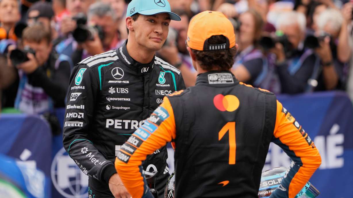 Mercedes driver George Russell of Britain, left, atlks to McLaren driver Lando Norris of Britain after the qualifying for the Formula One Dutch Grand Prix in Zandvoort , Netherlands, Saturday, Aug. 22, 2026.