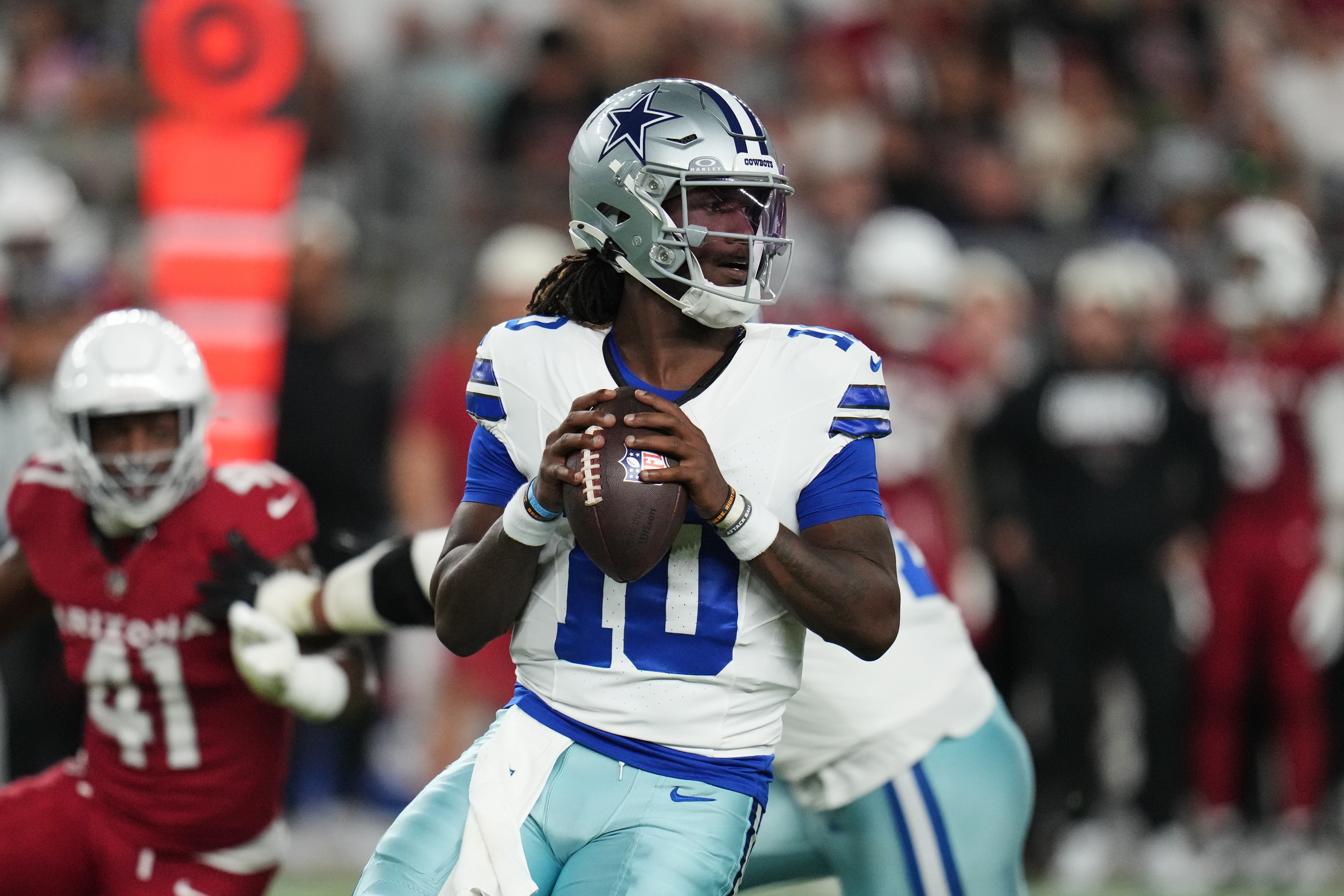 Dallas Cowboys quarterback Joe Milton III (10) drops back to pass in the first half of a preseason NFL football game against the Arizona Cardinals Saturday, Aug. 22, 2026, in Glendale, Ariz. 