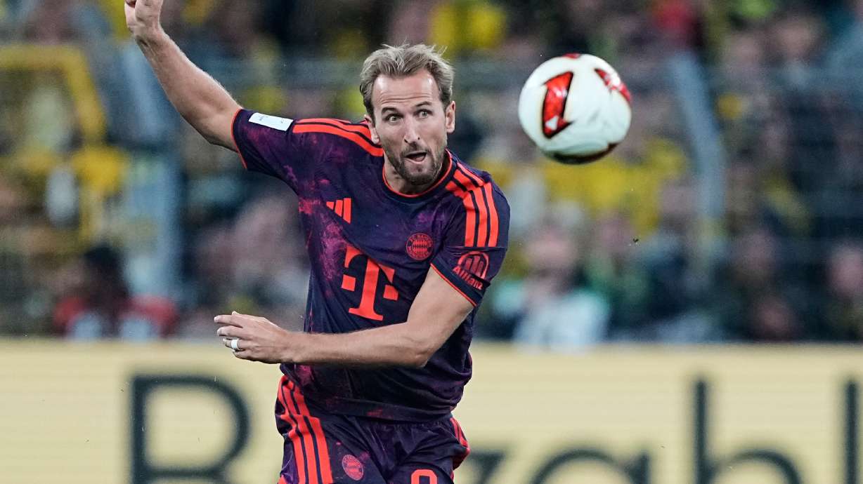Bayern's Harry Kane kicks the ball during the Franz Beckenbauer German Supercup soccer match between Borussia Dortmund and Bayern Munich in Dortmund, Germany, Saturday, Aug. 22, 2026.