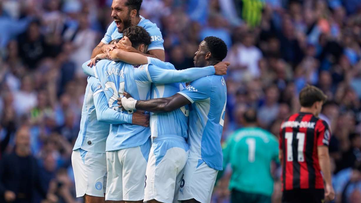 Manchester City's Josko Gvardiol (24) celebrates with teammates after scoring his side's second goal during the English Premier League soccer match between Manchester City and Bournemouth in Manchester, England, Sunday, Aug. 23, 2026.