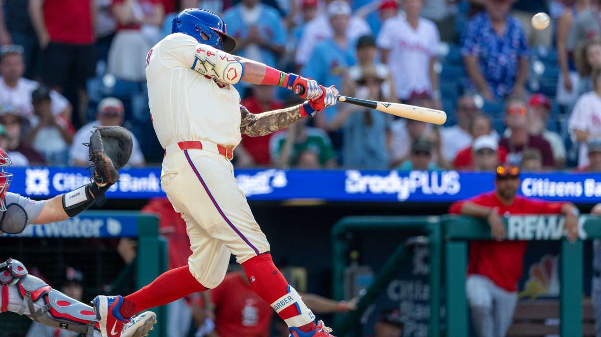 Philadelphia Phillies' Kyle Schwarber hits the winning home run in the ninth inning of a baseball game against the St. Louis Cardinals, Sunday, Aug. 23, 2026, in Philadelphia.