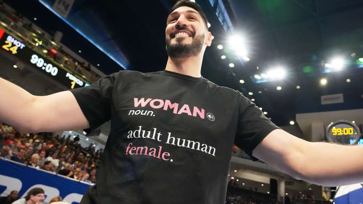 Former NBA center Enes Kanter Freedom greets a friend before a WNBA basketball game between the Indiana Fever and the Chicago Sky, Sunday, Aug. 23, 2026, in Chicago.