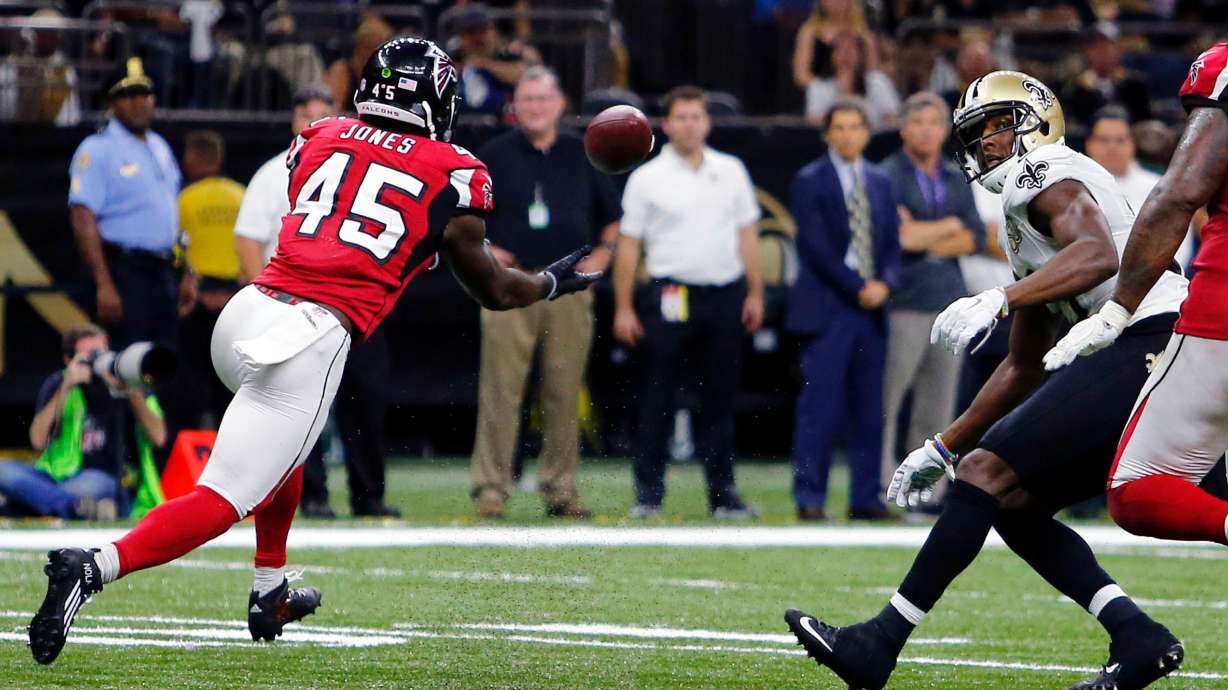 FILE - Atlanta Falcons outside linebacker Deion Jones (45) intercepts a pass from New Orleans Saints quarterback Drew Brees, not pictured, and returns it for a touchdown, in the second half of an NFL football game in New Orleans, on Sept. 26, 2016.