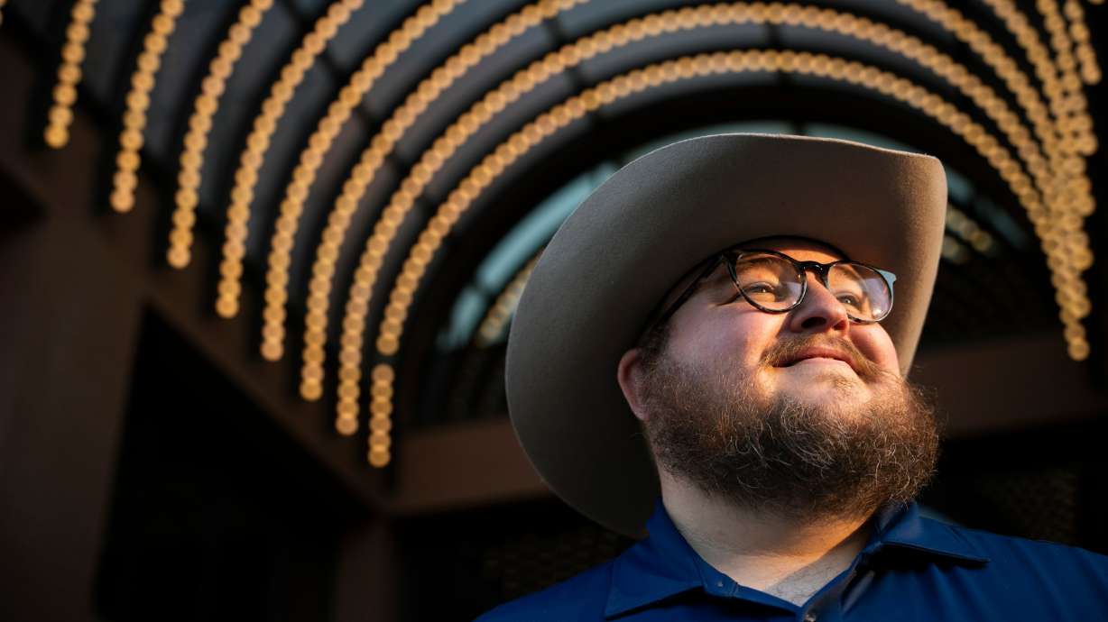 Giles Sims, who is getting a 90-hour bachelor of applied science in communication from Ensign College poses for a portrait on campus in Salt Lake City on Aug. 6.