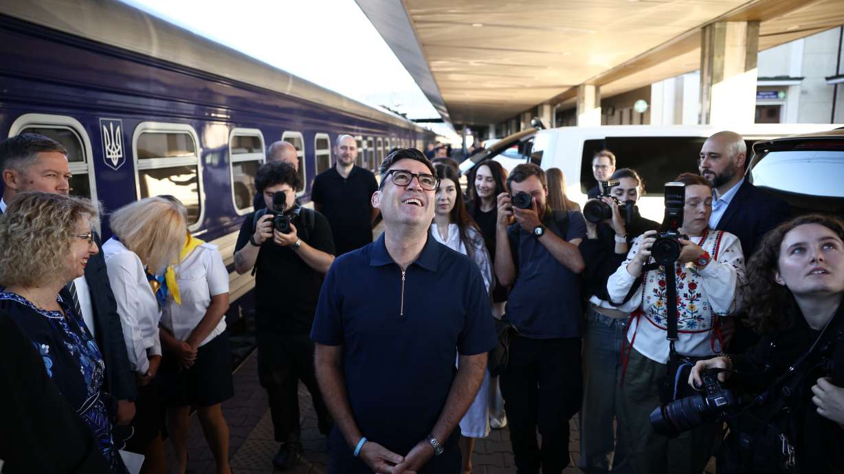 Britain's prime minister Andy Burnham, centre, smiles upon his arrival by train, in Kyiv, Monday. European leaders joined President Volodymyr Zelenskyy in Kyiv for the 35th anniversary of Ukraine's Independence Day.