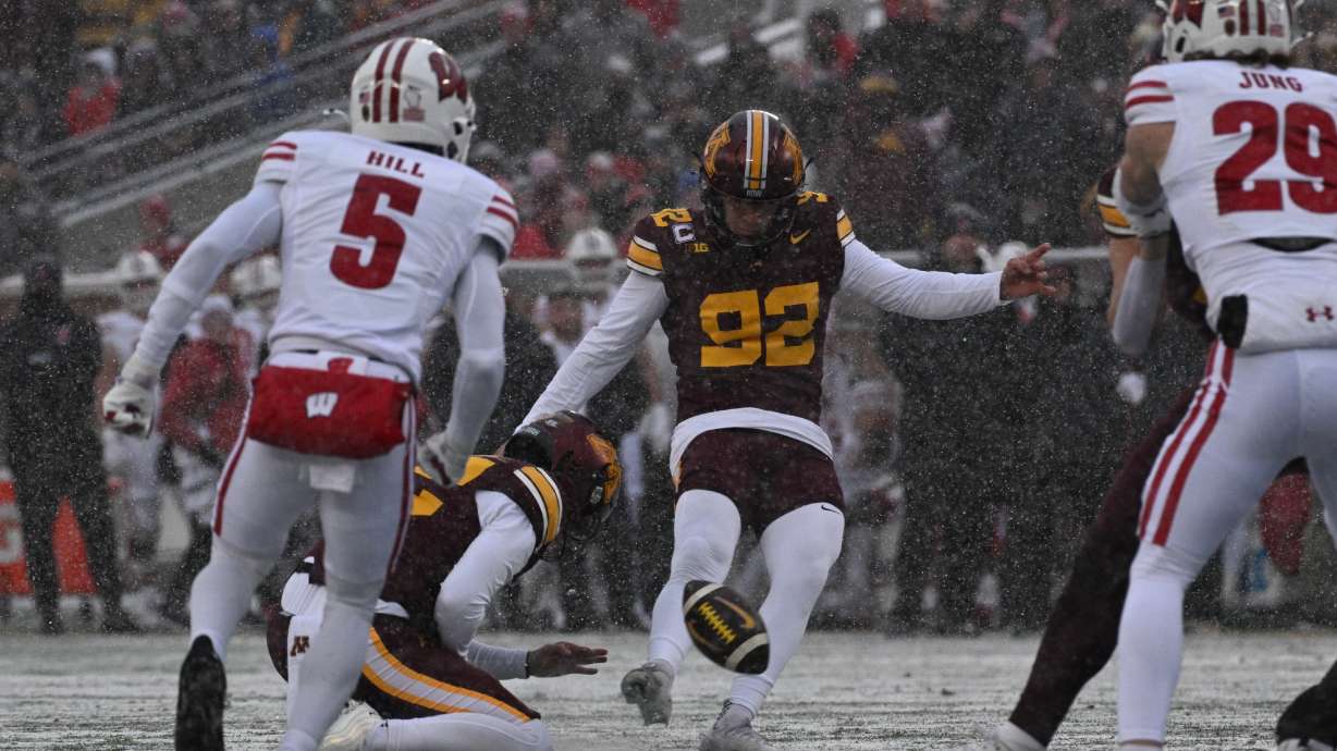 FILE - Minnesota kicker Brady Denaburg attempts a field goal during the first half of an NCAA college football game against Wisconsin Nov. 29, 2025, in Minneapolis.