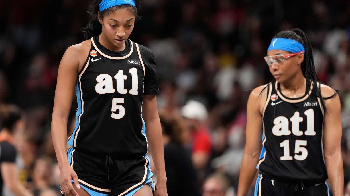 Atlanta Dream forward Angel Reese (5) and guard Allisha Gray (15) react in the second half of an WNBA basketball game Sunday, Aug. 16, 2026, in Atlanta.