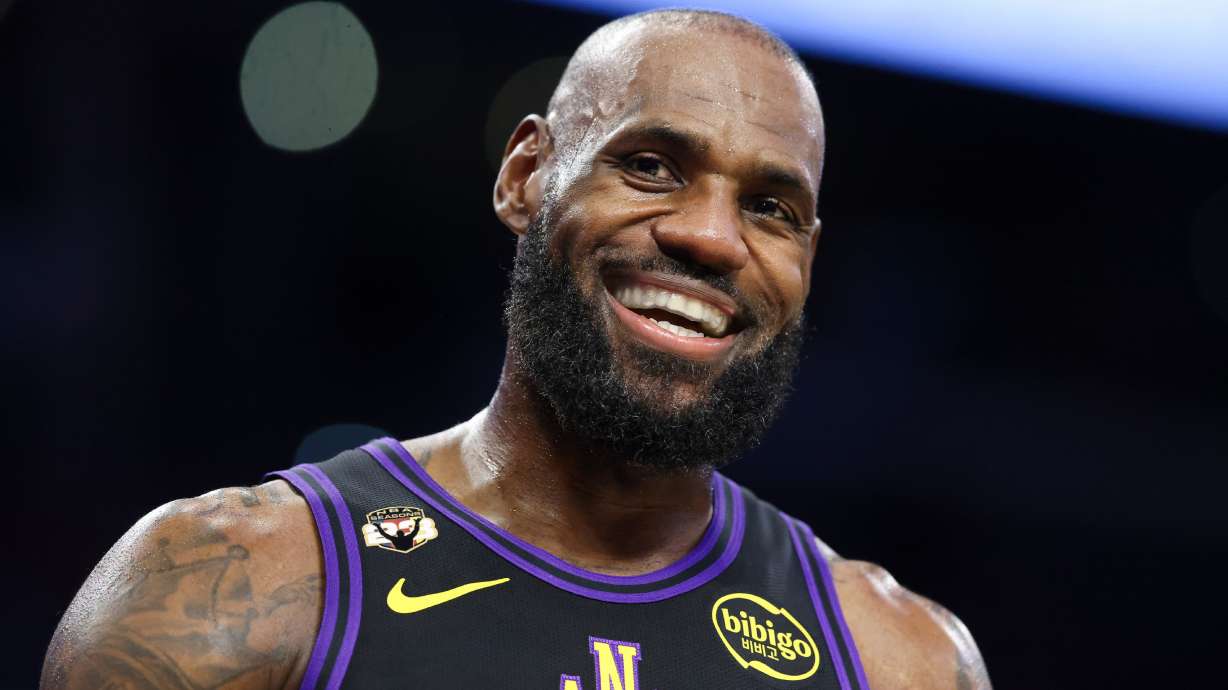 FILE - Los Angeles Lakers forward LeBron James reacts during the first half of an NBA basketball game against the Phoenix Suns, Friday, April 10, 2026, in Los Angeles.