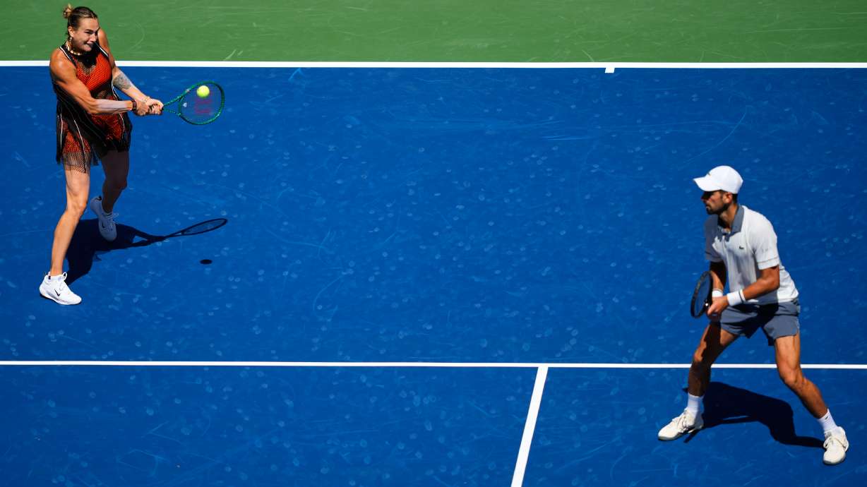 Aryna Sabalenka, of Belarus, and Novak Djokovic, of Serbia, during a mixed doubles match at the U.S. Open tennis championships, Tuesday, Aug. 25, 2026, in New York.