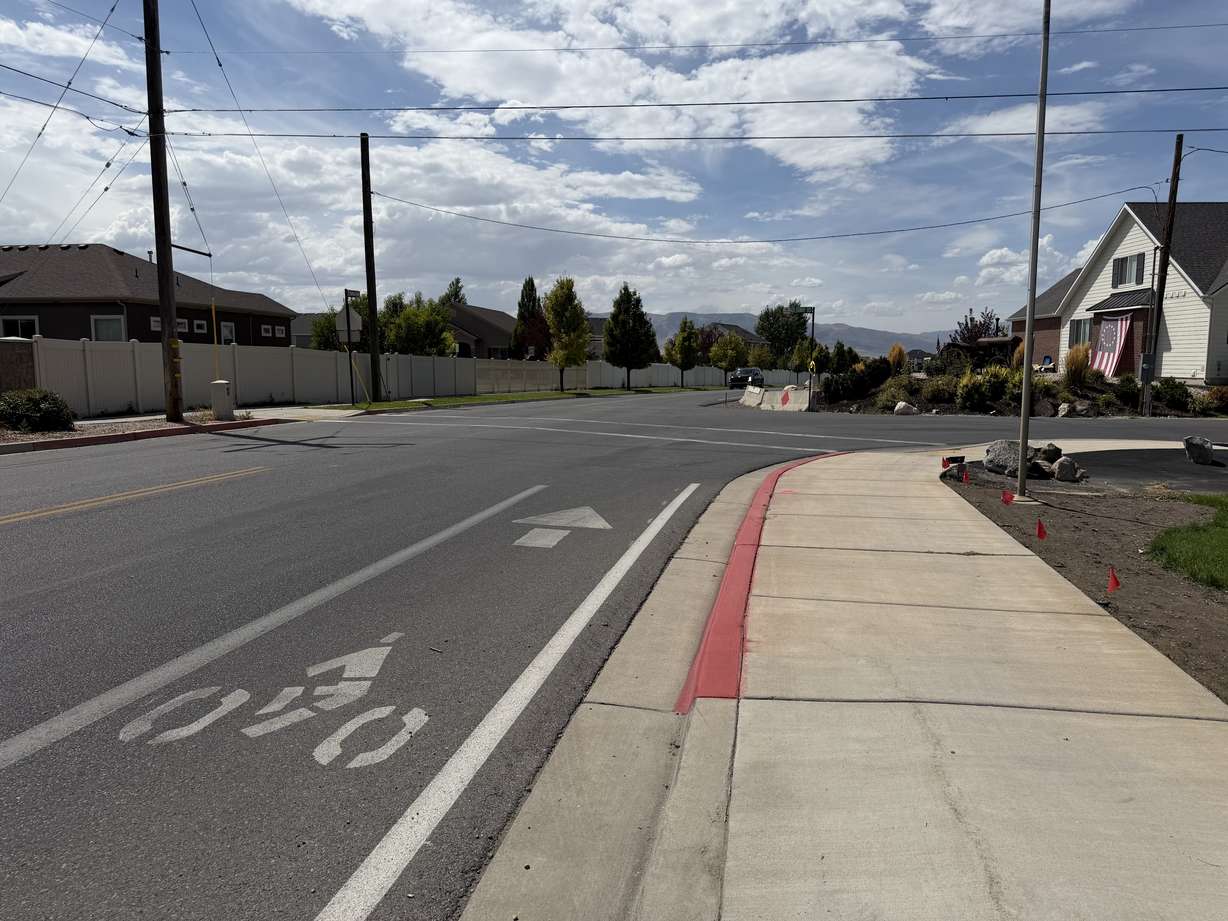 Bike lanes are seen east of Holdaway Road, looking west along 400 South, on Aug. 21, in Vineyard. The future of the road, which touches Councilman Jacob Holdaway's property, has been topic of heated debate for months in the city.
