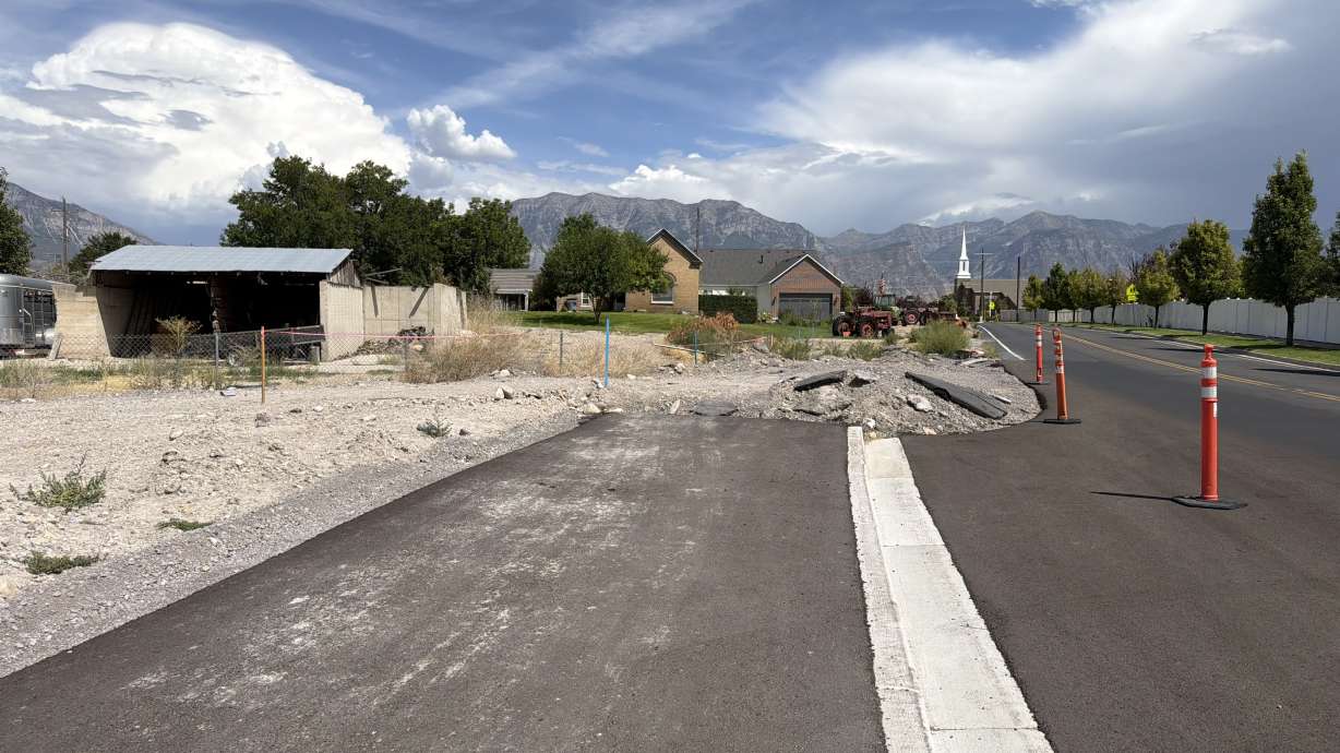 A paved trail suddenly ends along the north side of 400 South in Vineyard on Aug. 21. The future of the road has prompted debate for months because the unfinished segment touches property owned by Councilman Jacob Holdaway and his father.