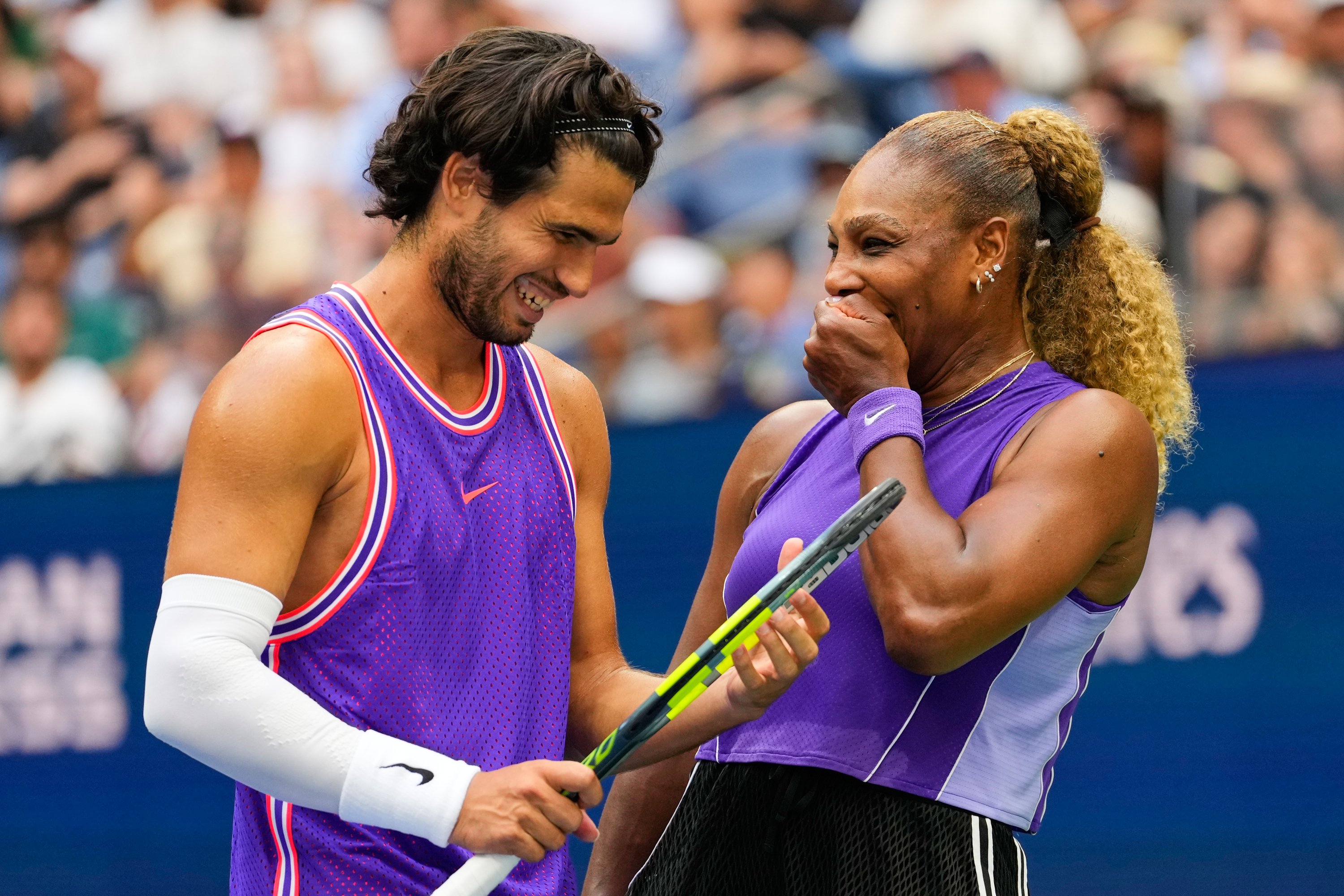 Carlos Alcaraz, of Spain, left, and Serena Williams, of the United States, talk on the court during a mixed doubles match at the U.S. Open tennis championships, Tuesday, Aug. 25, 2026, in New York. 