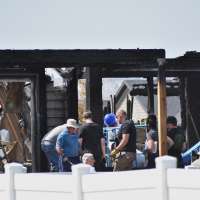 Investigators sift for evidence at burned Montana home where 8 relatives were killed at dinner