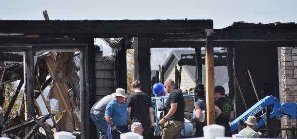 Investigators sift for evidence at burned Montana home where 8 relatives were killed at dinner